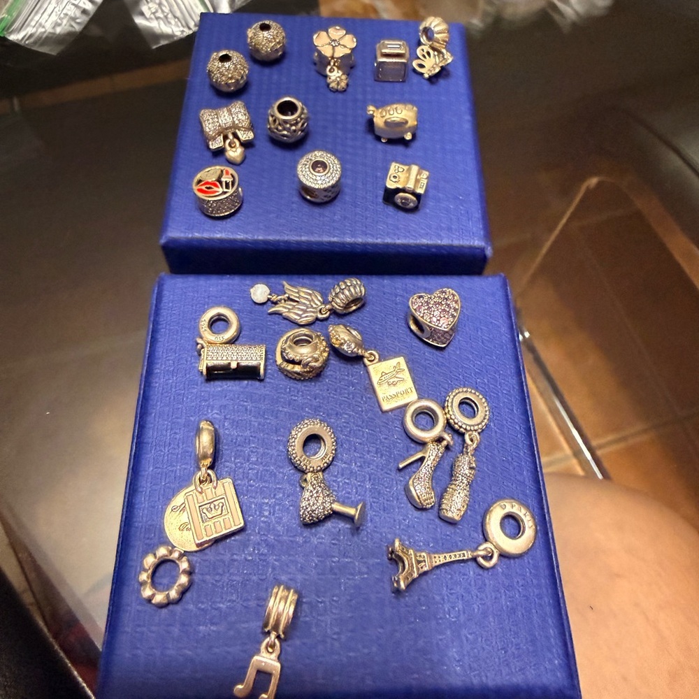 Pandora Gold and Rose Gold Charm Lot on Blue Displays